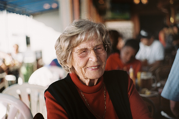 Older Lady Enjoying an Open Air Restaurant Bar